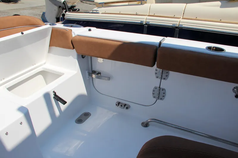 Slide: The Image of Interior view of 2025 Sea Hunt Ultra 275 SE boat with brown seating. - 22