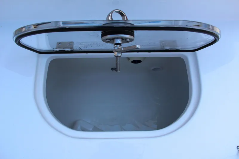 Slide: The Image of Open storage compartment on 2025 Sea Hunt Ultra 275 SE boat. - 29
