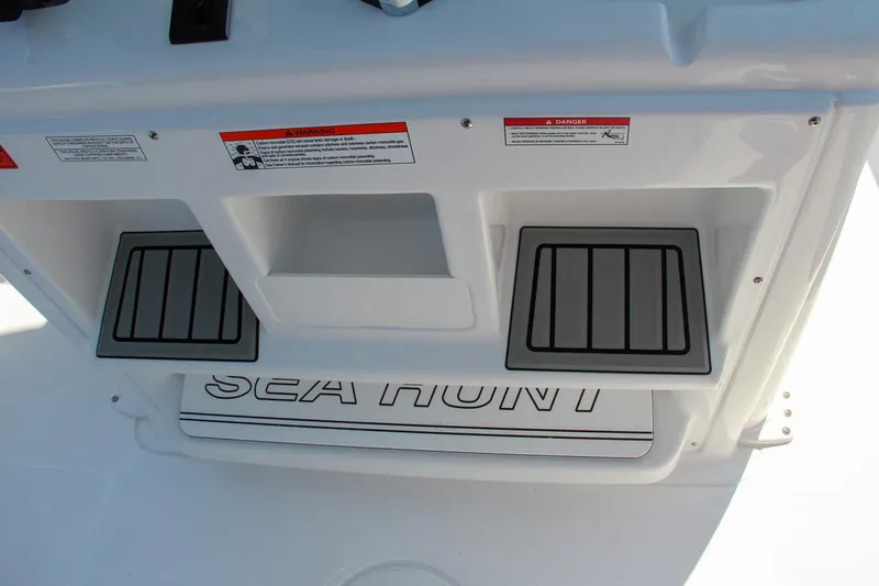 Slide: The Image of 2025 Sea Hunt Ultra 275 SE boat deck with storage compartments. - 41