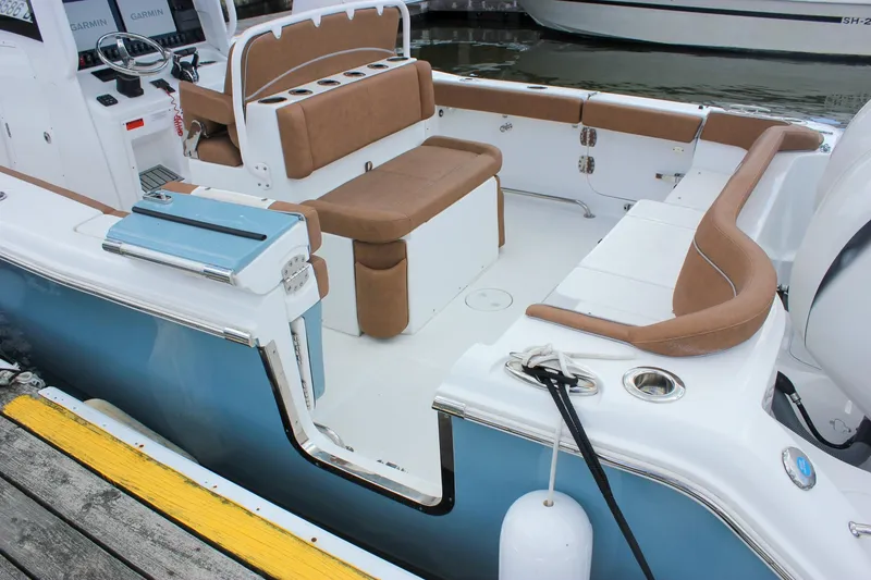 Slide: The Image of 2025 Sea Hunt Ultra 275 SE boat interior with tan seating and modern design. - 5