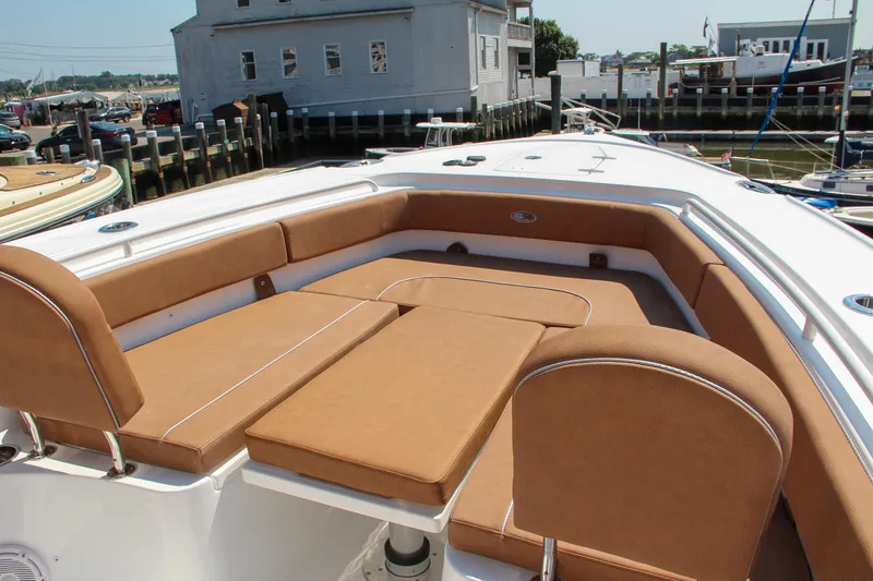 Slide: The Image of 2025 Sea Hunt Ultra 275 SE boat with spacious tan seating area. - 53