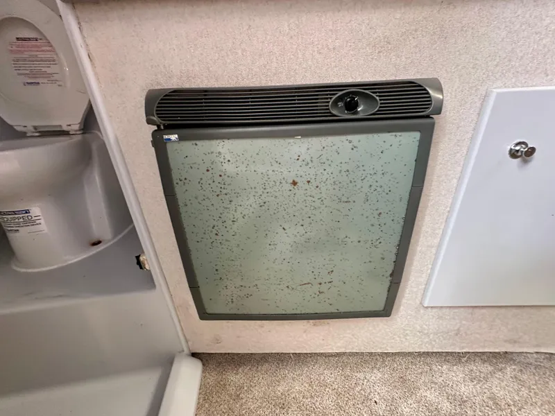 Slide: The Image of Aging refrigerator in 2002 Custom Carolina 40 Express Sportfisherman boat interior. - 28