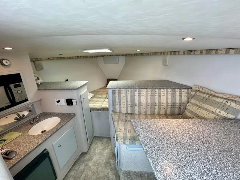 Slide: The Image of Interior of 2002 Custom Carolina 40 Express Sportfisherman with kitchenette and seating area. - 30