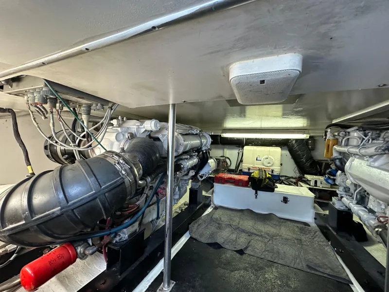 Slide: The Image of Engine room of 2002 Custom Carolina 40 Express Sportfisherman, showcasing mechanical components. - 32
