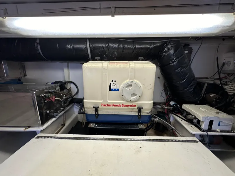 Slide: The Image of Engine room of 2002 Custom Carolina 40 Express Sportfisherman with Fischer Panda generator. - 37