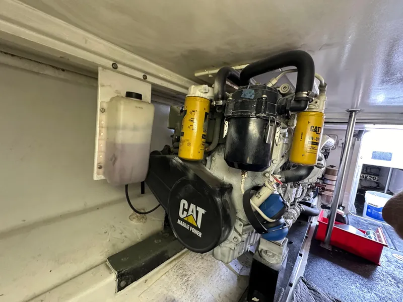 Slide: The Image of Engine room of 2002 Custom Carolina 40 Express Sportfisherman with CAT Marine Power engine. - 38