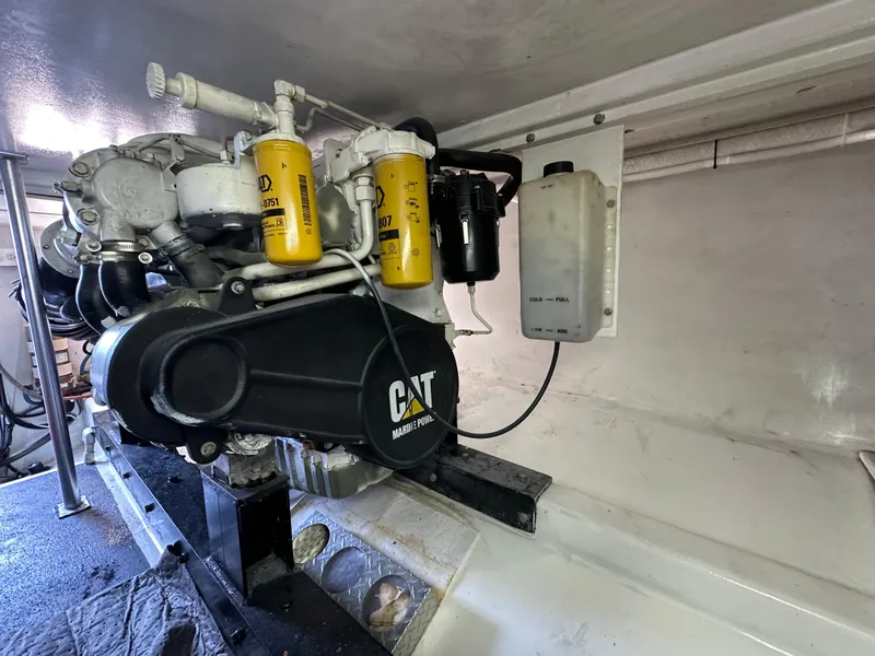 Slide: The Image of Engine compartment of 2002 Custom Carolina 40 Express Sportfisherman with CAT marine power. - 39
