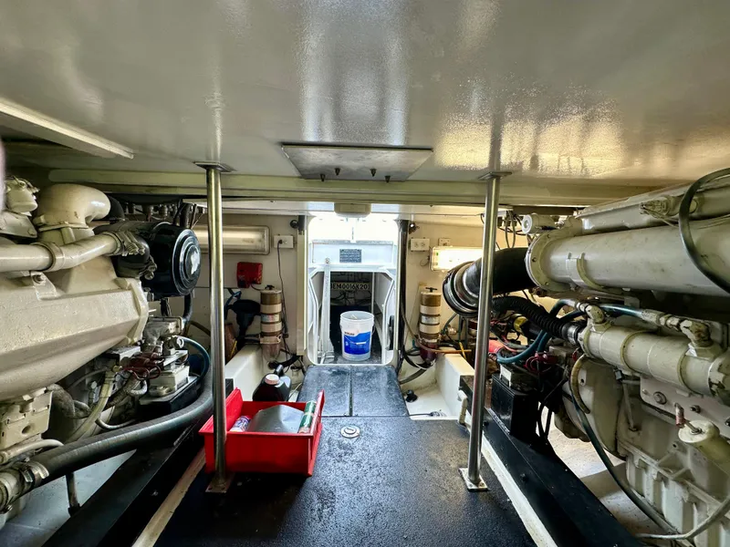 Slide: The Image of Engine room of 2002 Custom Carolina 40 Express Sportfisherman, showcasing machinery and equipment. - 40