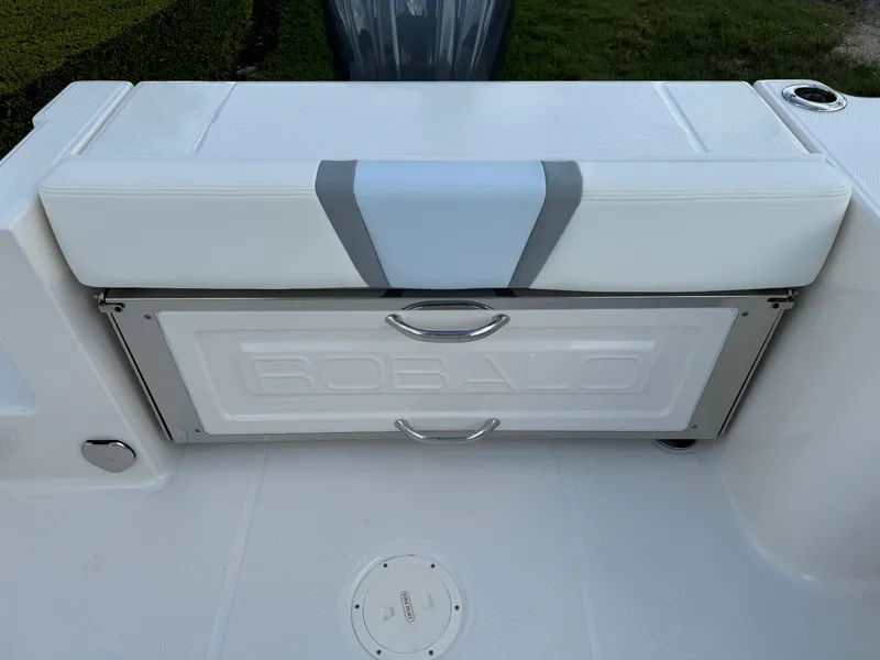 Slide: The Image of 2025 Robalo R230 Center Console boat seat with storage compartment. - 10