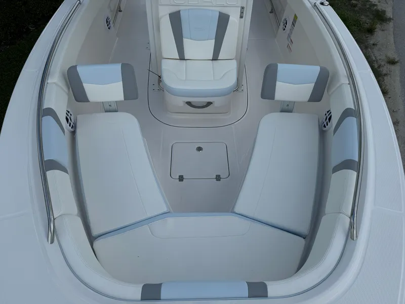 Slide: The Image of 2025 Robalo R230 Center Console boat interior with cushioned seating and modern design. - 14