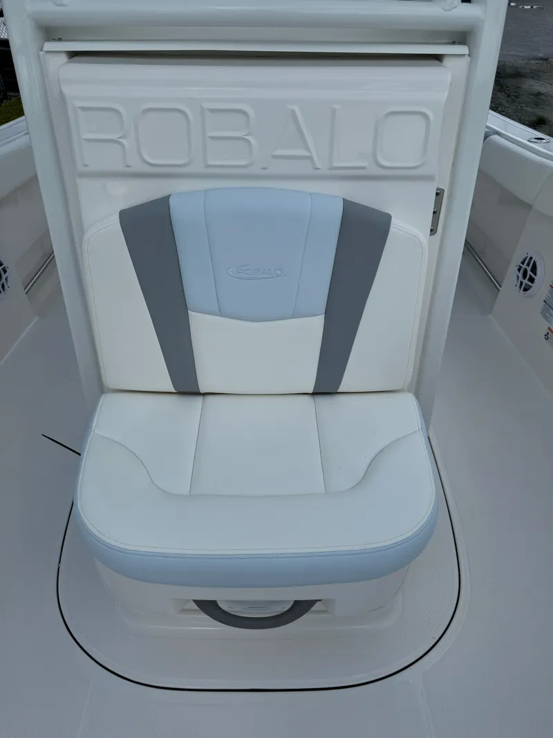 Slide: The Image of 2025 Robalo R230 Center Console boat seat with embossed logo and stylish design. - 17