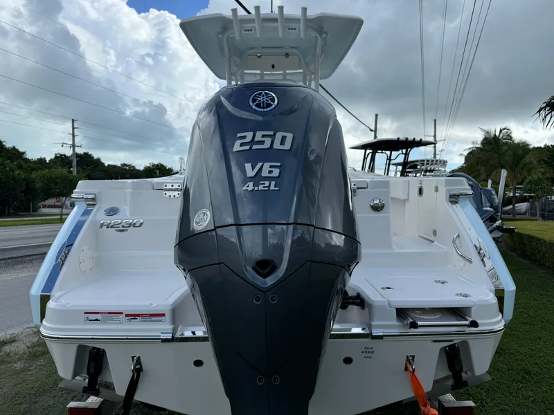 Slide: The Image of 2025 Robalo R230 Center Console boat with Yamaha 250 V6 engine, rear view. - 4