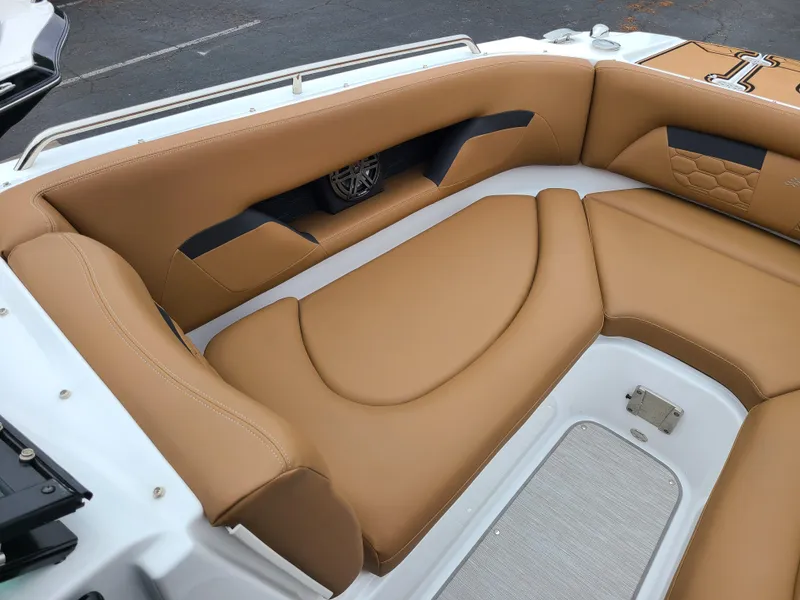 Slide: The Image of 2023 Four Winns HD5 boat interior with tan leather seating. - 5