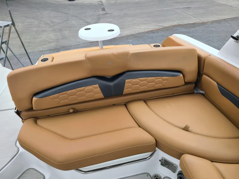 Slide: The Image of 2023 Four Winns HD5 boat with tan leather seating and modern design. - 9