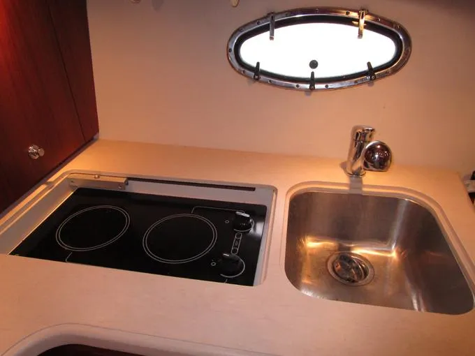 Slide: The Image of Cook Top and Sink with Corian Covers - 25