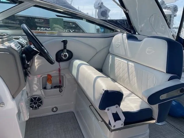 Slide: The Image of Interior of 2023 Crownline 270 CR boat with white and blue seating. - 13