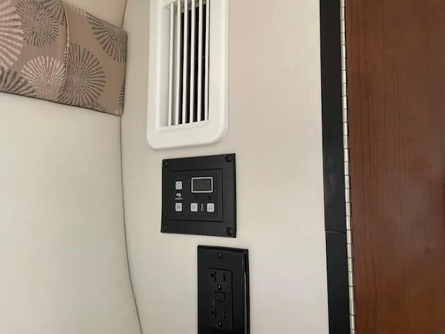 Slide: The Image of Interior of 2023 Crownline 270 CR boat with control panel and vent. - 23