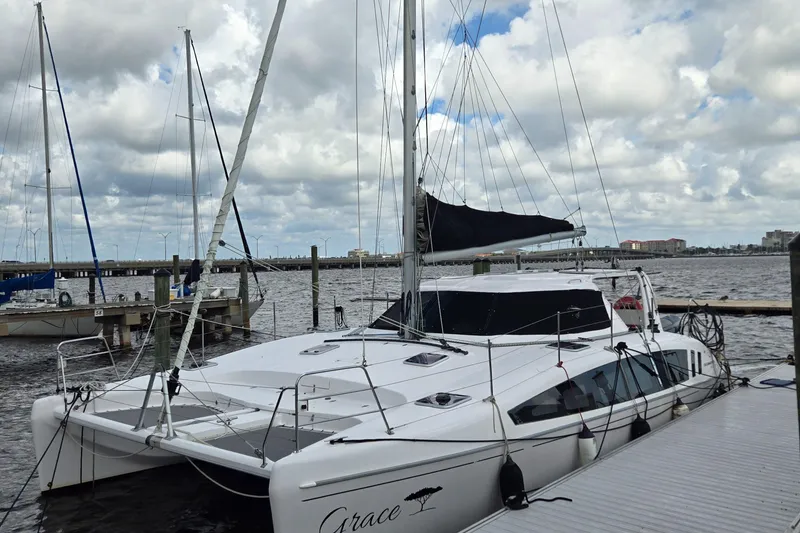 Slide: The Image of 2019 Seawind 1160 Lite catamaran docked at a marina in Tampa Bay area. - 12