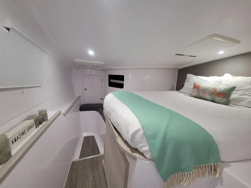 Slide: The Image of Cozy interior cabin of 2019 Seawind 1160 Lite catamaran with queen bed and decor. - 5