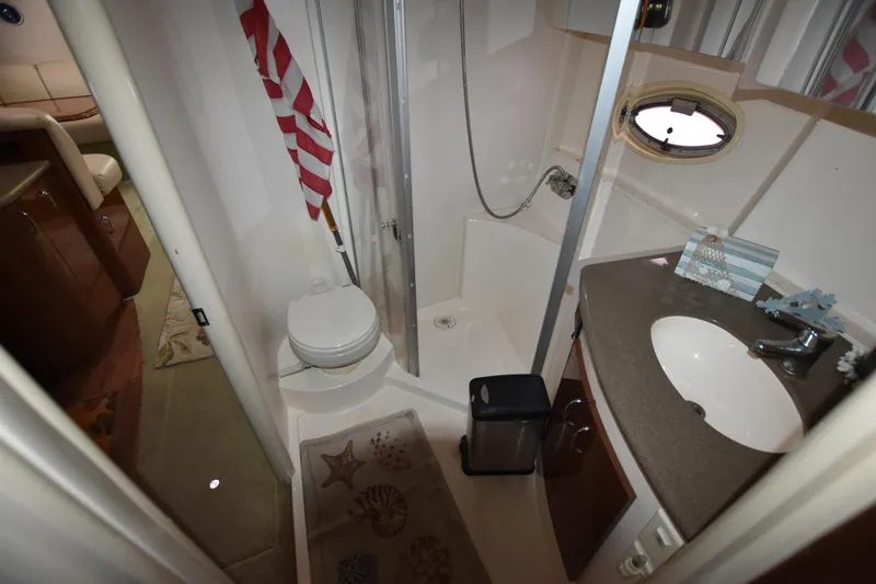 Slide: The Image of 2007 Carver 36 Mariner bathroom with shower, sink, and toilet. - 15