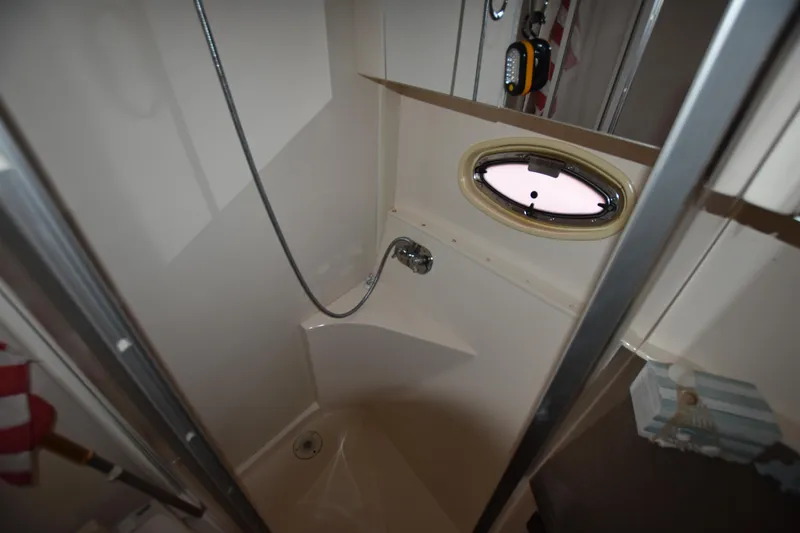Slide: The Image of Shower area in 2007 Carver 36 Mariner yacht with porthole window. - 16