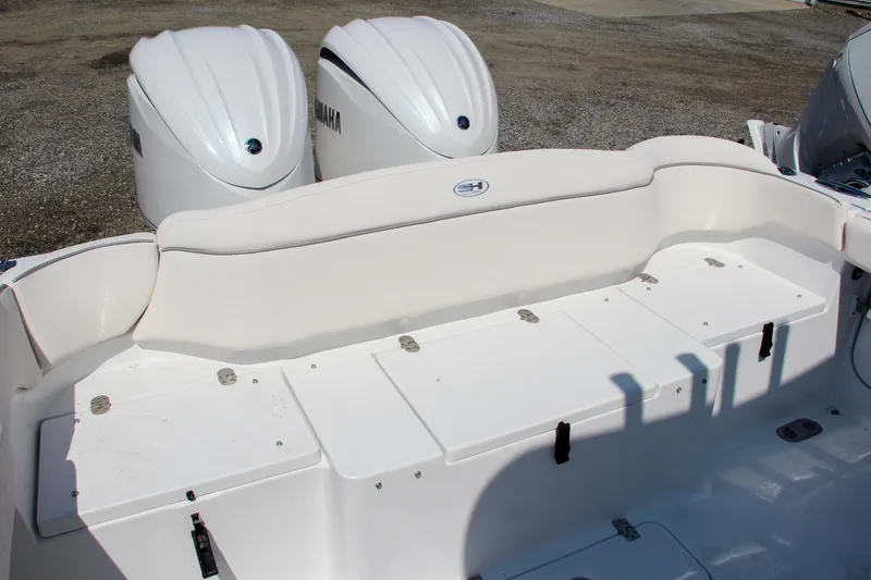 Slide: The Image of 2025 Sea Hunt Ultra 275 SE boat with dual Yamaha engines, rear seating area. - 13