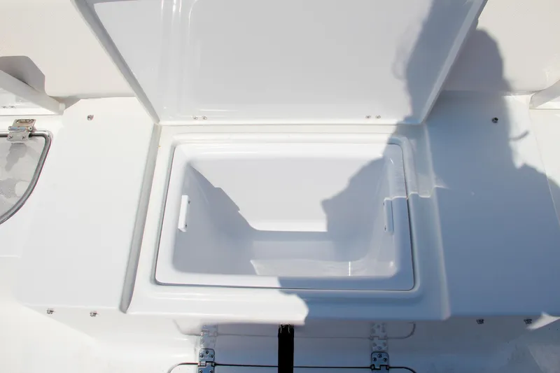 Slide: The Image of Open storage compartment on 2025 Sea Hunt Ultra 275 SE boat. - 16