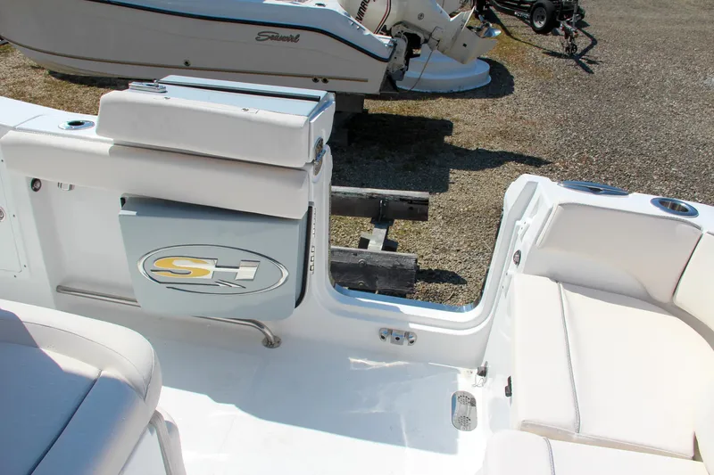 Slide: The Image of 2025 Sea Hunt Ultra 275 SE boat interior with seating and storage. - 26