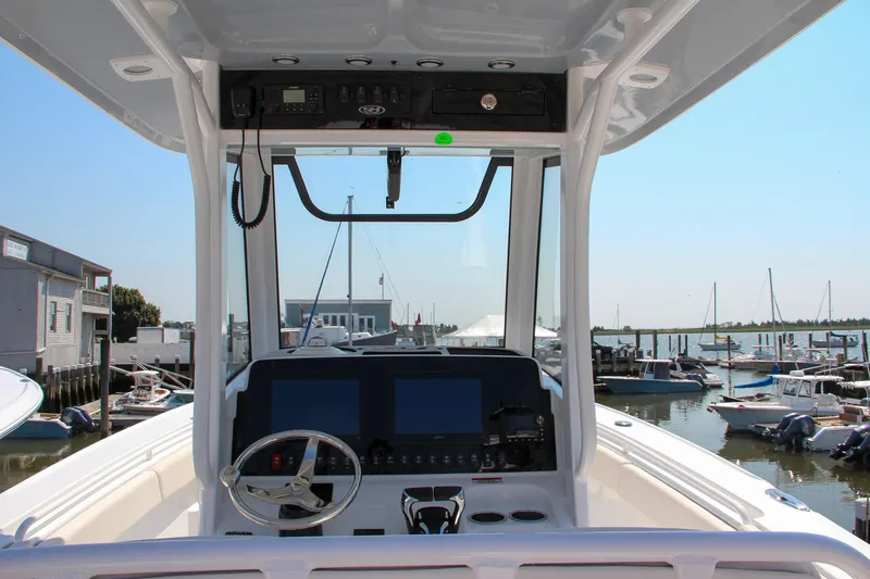 Slide: The Image of 2025 Sea Hunt Ultra 275 SE boat dashboard at marina. - 29