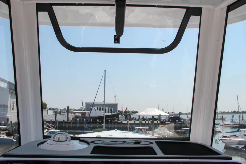 Slide: The Image of View from Sea Hunt Ultra 275 SE boat cockpit, overlooking marina, 2025 model. - 38