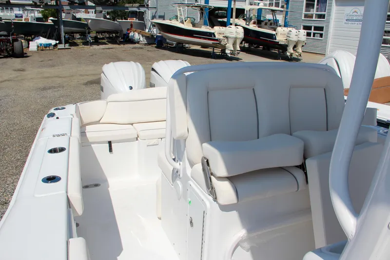 Slide: The Image of 2025 Sea Hunt Ultra 275 SE boat interior with white seating and modern design. - 45