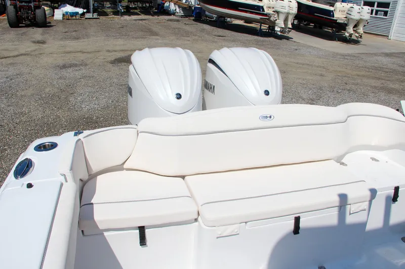 Slide: The Image of 2025 Sea Hunt Ultra 275 SE boat with dual Yamaha engines, rear seating view. - 46