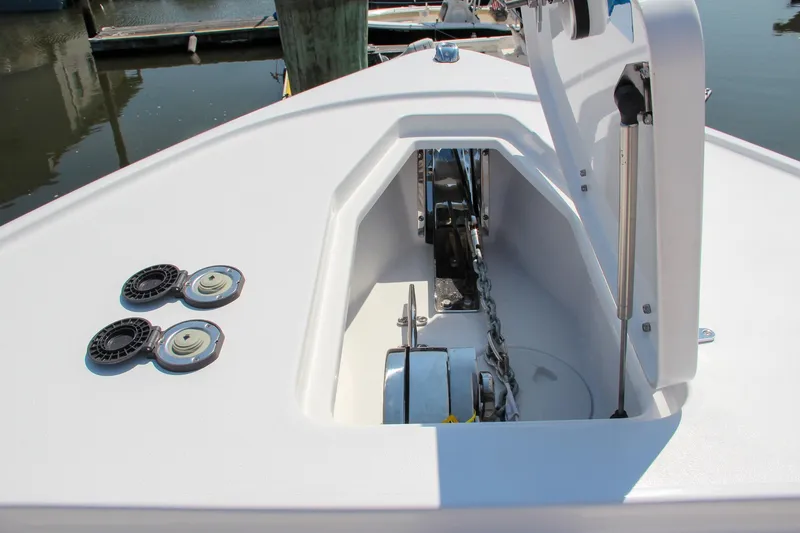 Slide: The Image of 2025 Sea Hunt Ultra 275 SE boat anchor compartment and deck details. - 52