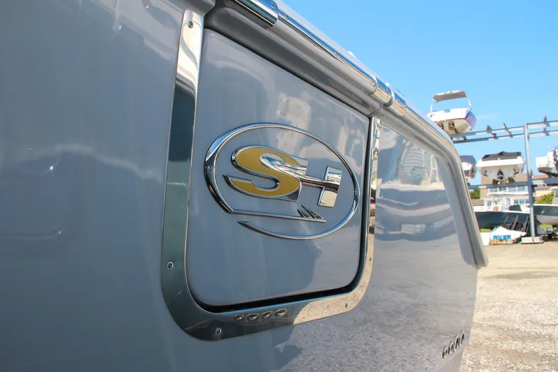 Slide: The Image of 2025 Sea Hunt Ultra 275 SE boat logo on sleek gray exterior. - 8