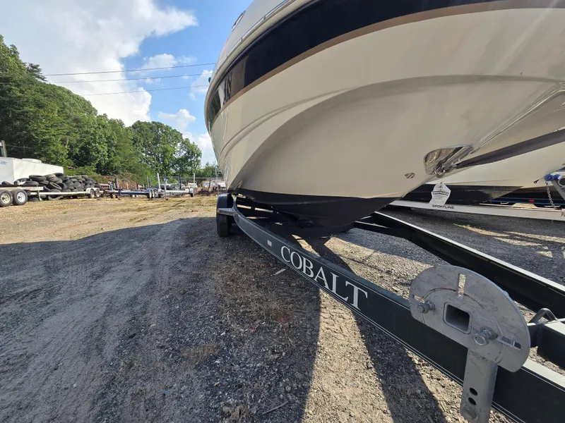 Slide: The Image of 2005 Chaparral 236 Sunesta boat on Cobalt trailer in outdoor setting. - 28