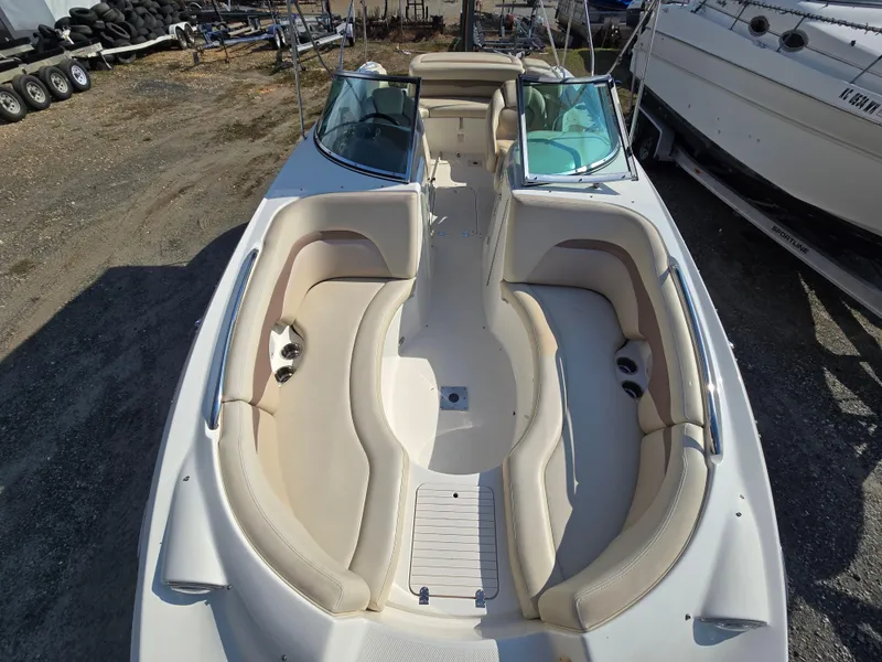 Slide: The Image of 2005 Chaparral 236 Sunesta boat with spacious seating and dual windshields. - 7