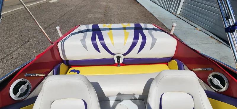 Slide: The Image of 2005 Baja 202 Islander boat interior with colorful upholstery and speaker system. - 11