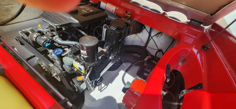 Slide: The Image of 2005 Baja 202 Islander engine compartment with visible components and fire extinguisher. - 17