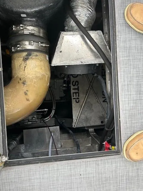 Slide: The Image of Engine compartment of 2023 Smoky Mountain asymmetrical foil-assisted catamaran, showing mechanical components. - 15