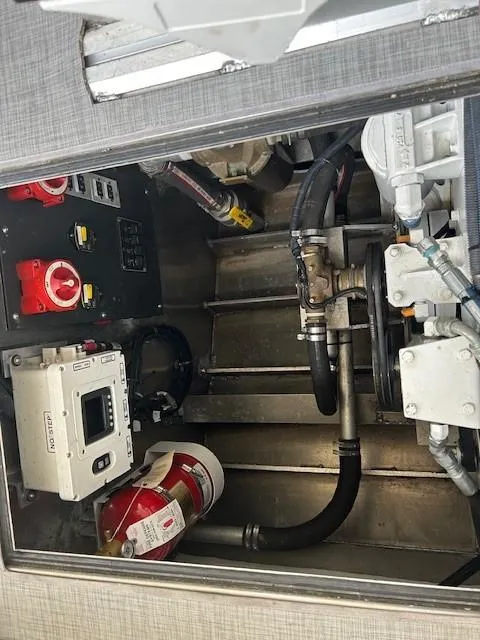 Slide: The Image of Engine compartment of 2023 Smoky Mountain Asymmetrical foil assisted catamaran, showing mechanical components. - 17