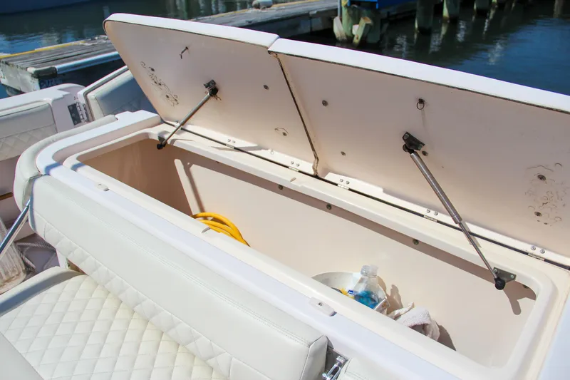 Slide: The Image of Open storage compartment on 2003 Grady-White Express 330 boat, dockside view. - 12