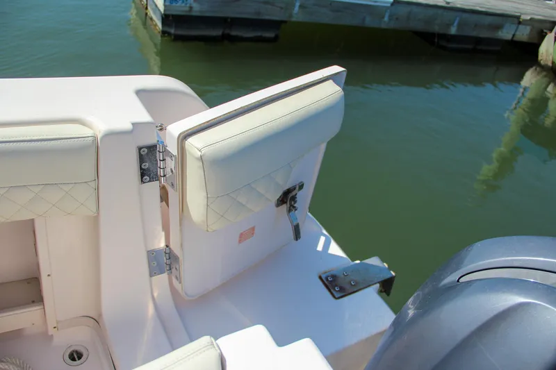 Slide: The Image of Grady-White Express 330 boat, 2003 model, open transom door near water. - 13