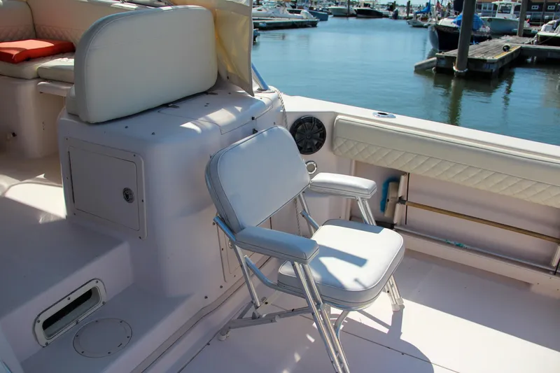 Slide: The Image of 2003 Grady-White Express 330 boat interior with seating, docked at marina. - 15