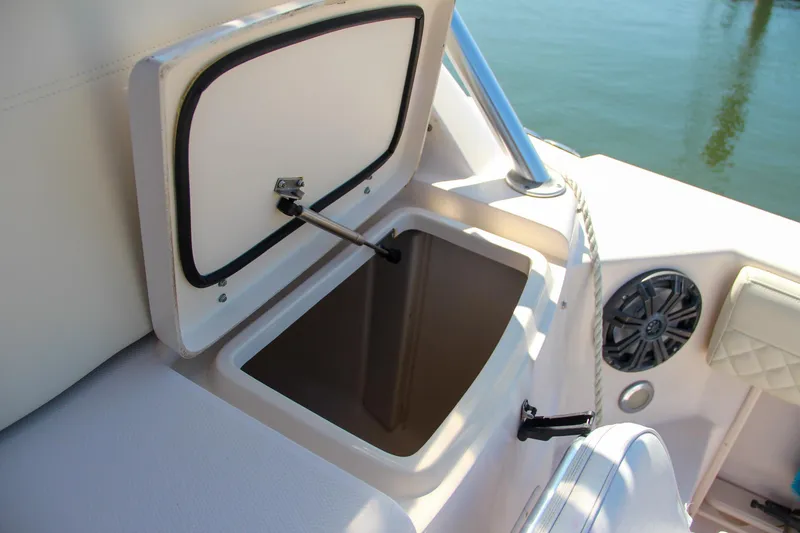 Slide: The Image of Open storage compartment on 2003 Grady-White Express 330 boat interior. - 16