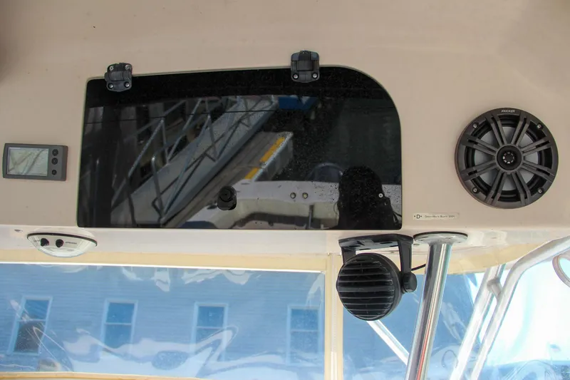 Slide: The Image of Interior view of 2003 Grady-White Express 330 boat with speakers and control panel. - 27