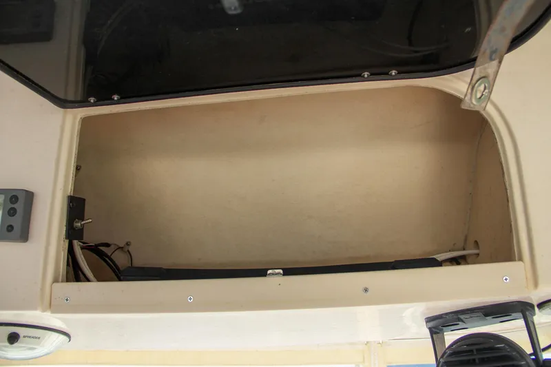 Slide: The Image of Open storage compartment on 2003 Grady-White Express 330 boat. - 28