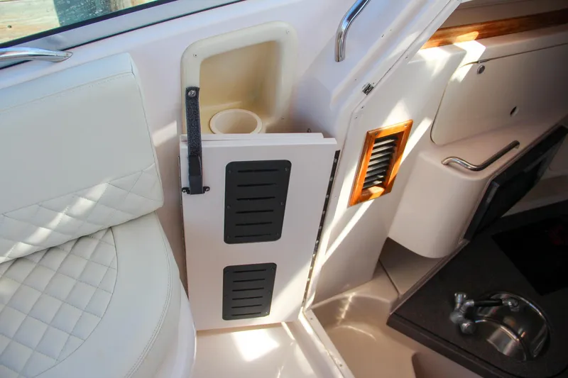 Slide: The Image of Interior of 2003 Grady-White Express 330 boat with seating and storage compartments. - 31