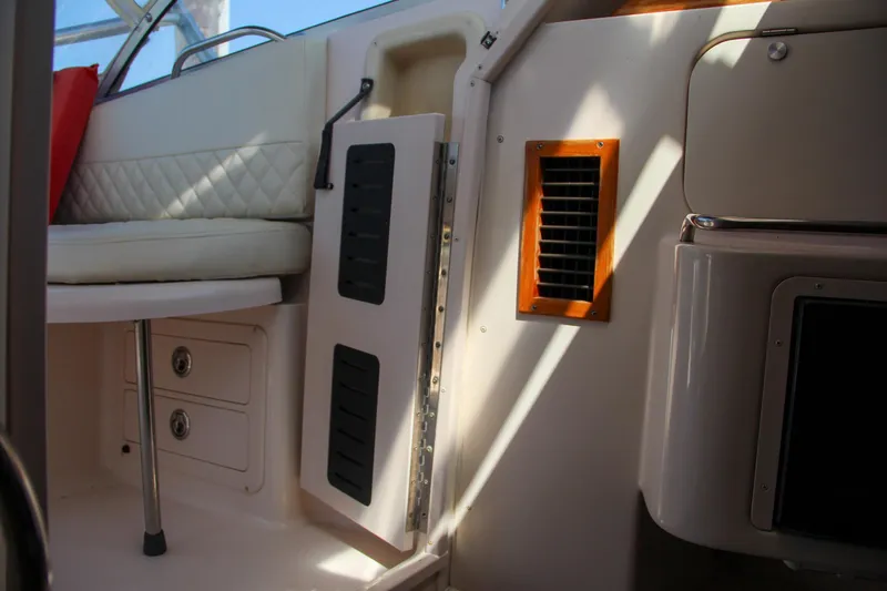 Slide: The Image of Interior of 2003 Grady-White Express 330 boat with seating and storage compartments. - 40