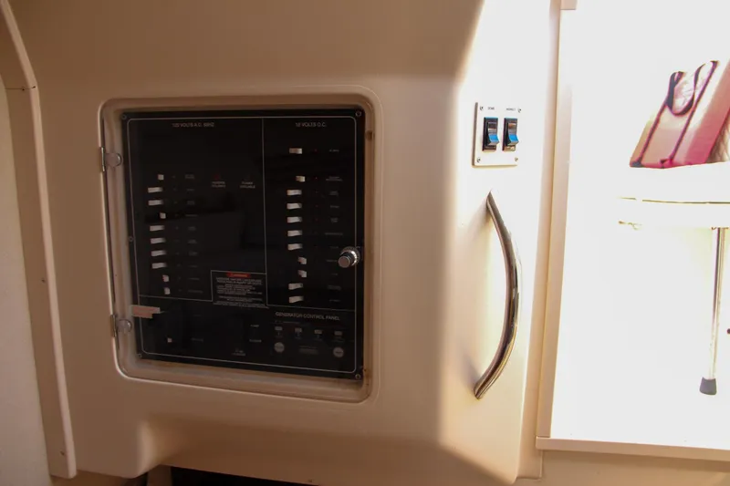 Slide: The Image of Electrical panel inside 2003 Grady-White Express 330 boat cabin. - 41