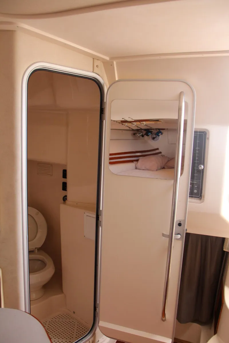 Slide: The Image of 2003 Grady-White Express 330 boat interior with bathroom and cabin view. - 46